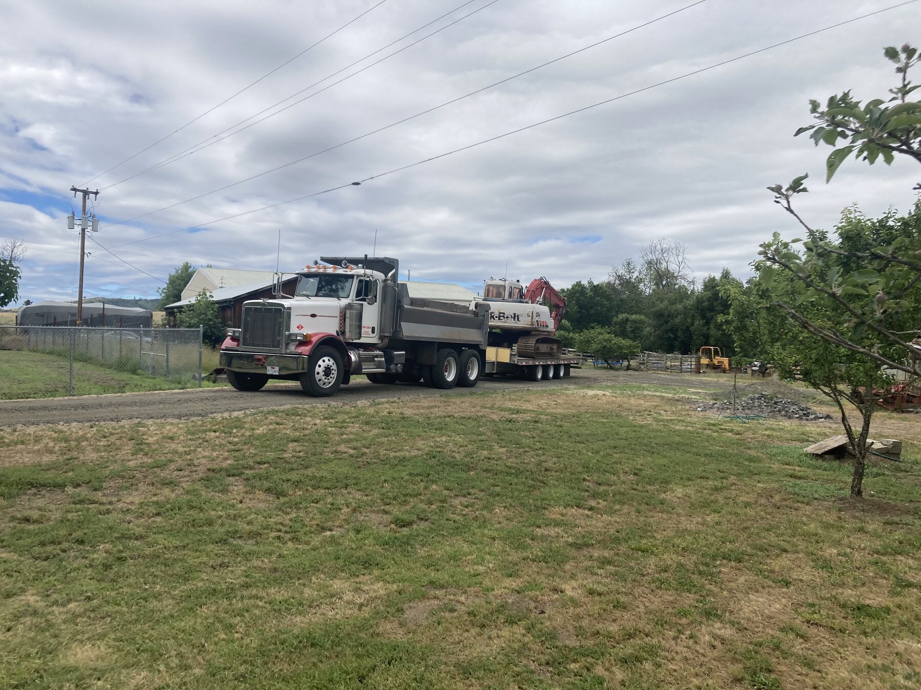 Russco's excavator and dump truck ready for work in the Roseburg area of Douglas County.